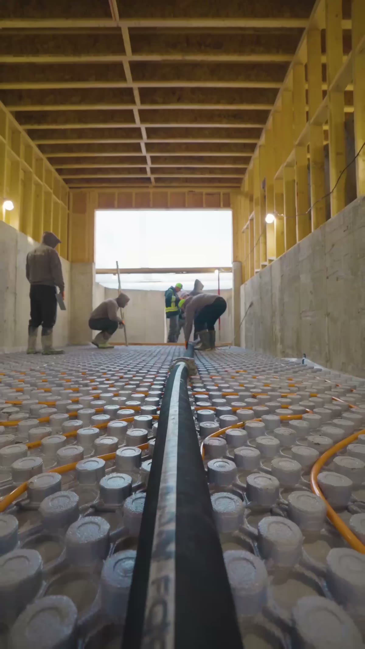 Concrete Master crew finishing a basement floor pour, Richmond Hill