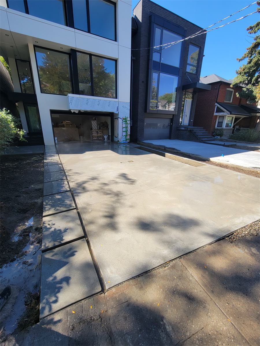 Finished broom-and-smooth concrete driveway
